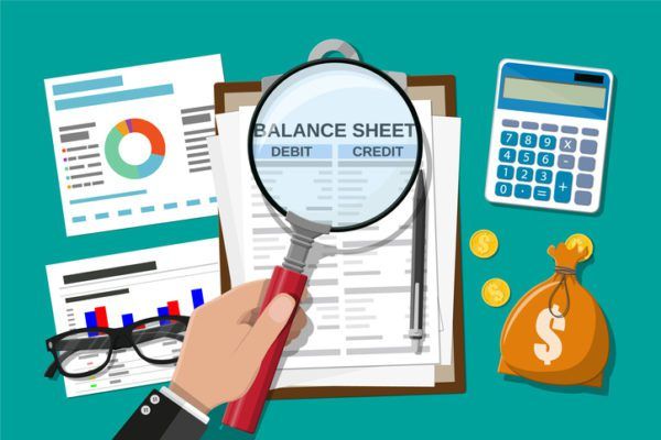 Clipboard with balance sheet and pen. Calculator money balance. Financial reports statement and documents. Accounting, bookkeeping, audit debit and credit calculations. 