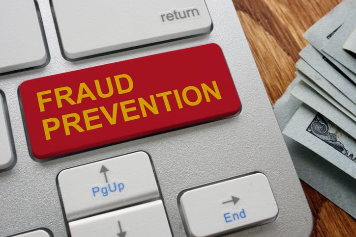 Red button fraud prevention on the keyboard.
