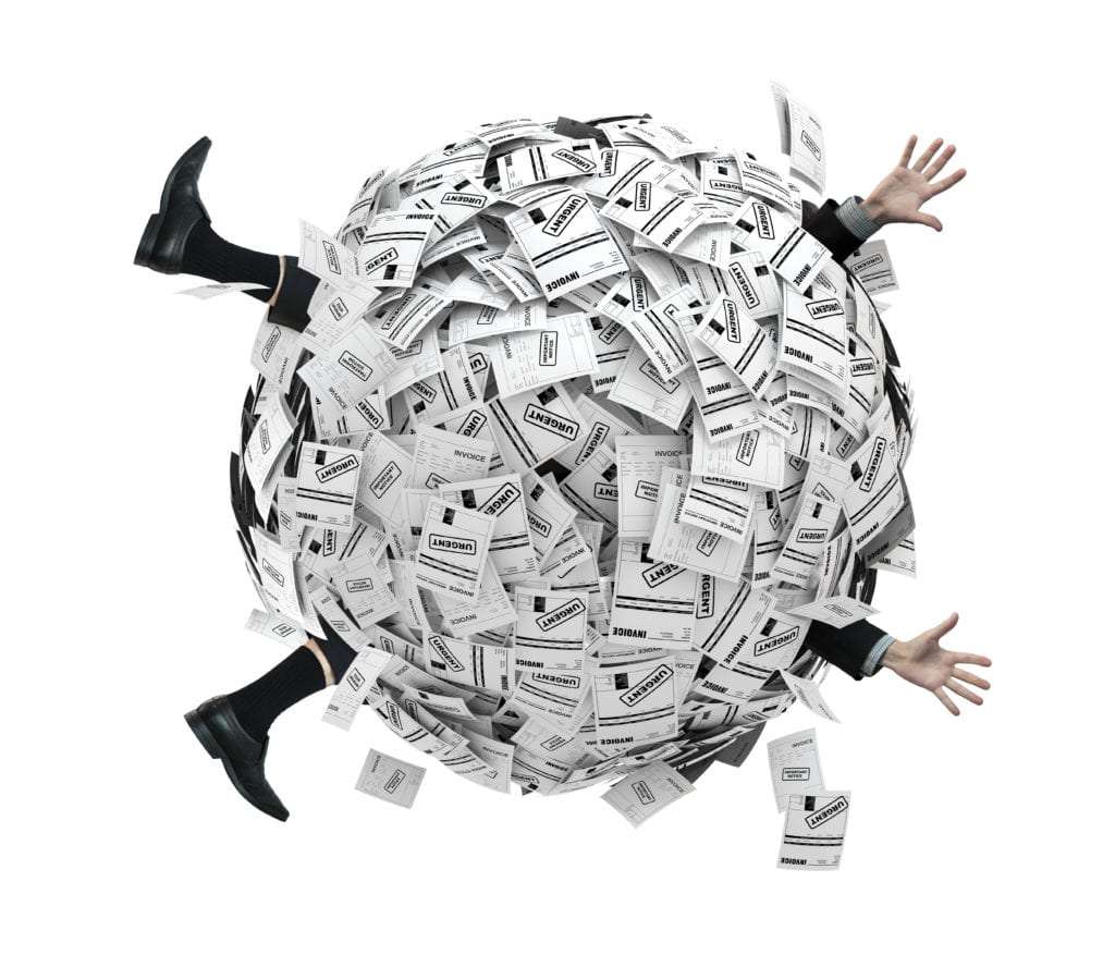 Businessman buried in sphere of financial invoices.