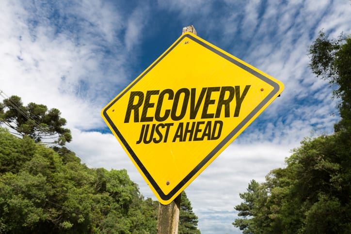Recovery Just Ahead on road sign