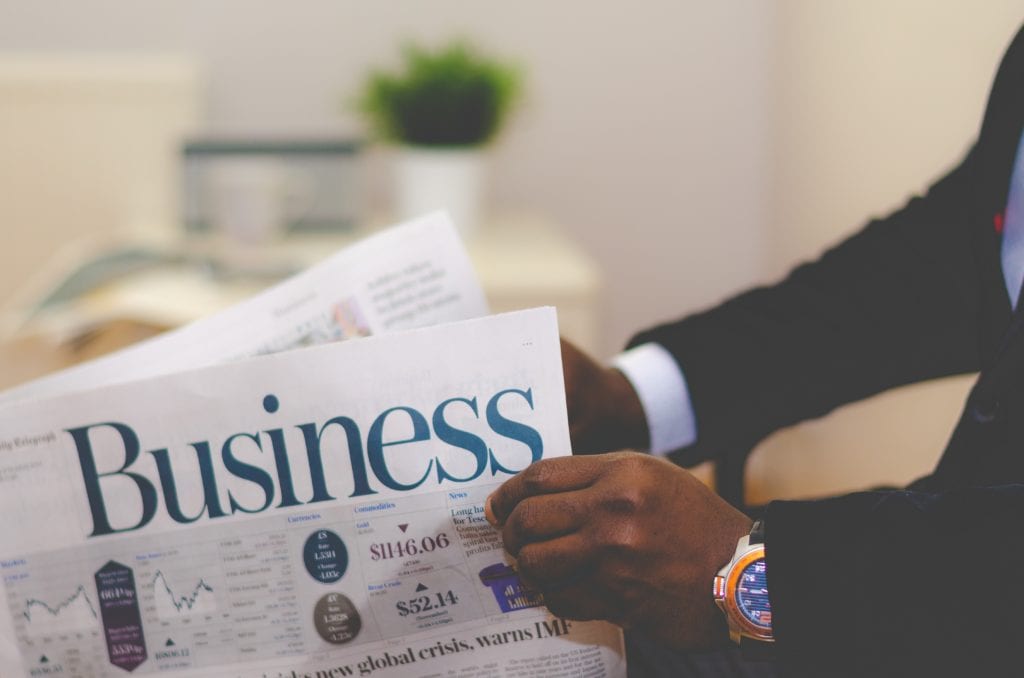 Businessman holding a newspaper.