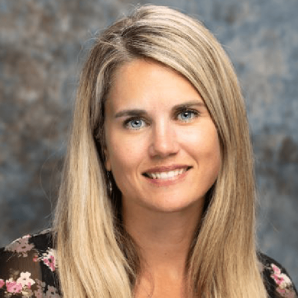 Professional headshot of a smiling woman with blonde hair, Michelle Massie.