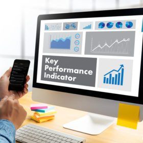 KPI acronym (Key Performance Indicator) Plan businessman hand working