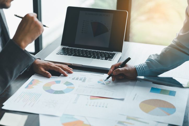 Business team collaboration discussing working analyzing with financial data and marketing growth report graph in team, presentation and brainstorming to strategy planning making profit of company.