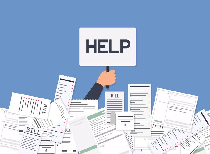 Businessman needs help under a lot of bills avoiding common mistakes in debtor management.