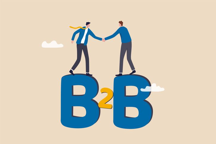 B2B business to business lending between corporate concept, confidence businessmen partner handshake to agree business deal on alphabet B2B.